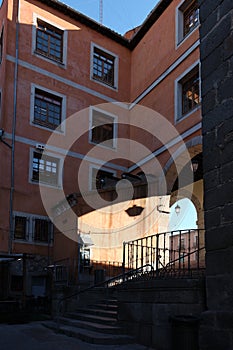 View of the entrance with stairway to the Plaza del Mercado Chico seen from  the Martin Carramolino street, Avila, Spain photo