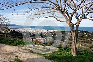 The view from Eratinis street lookout at Patras city in Greece with tree and bench for relaxation and see the beautiful cityscape