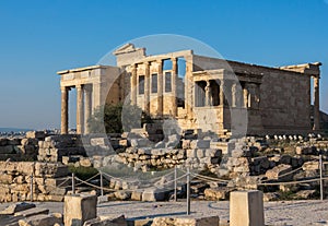 View of Erechtheion and porch of Caryatids on Acropolis, Athens, Greece, against sunset