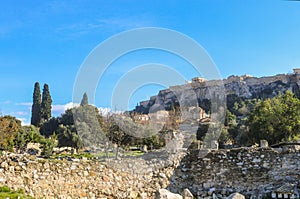 View of the Erechtheum temple dedicated to Poseidon Athena on the Accropolis in Athens Greece viewed from the ancient Agora below