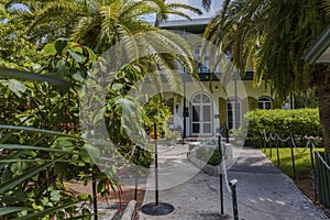 View on The Ernest Hemingway Home and Museum. Beautiful green trees at the entrance checkpoint. USA. Key West. photo