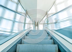 View of escalator in business centre in motion.