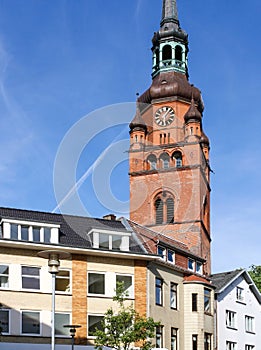 View of european building exterior and St. Laurentii church clock tower in Itzehoe, Germany.