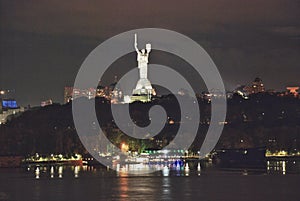 View of the evening city of Kiev, Ukraine, the Dnieper River.  Monument Mother Motherland.