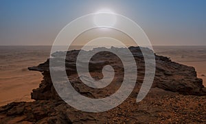 View on the evening sun over the top of the holy mountain Jebel Barkal in Karima, Sudan, africa