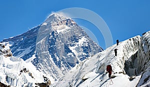 View of Everest from Gokyo valley with group of climbers