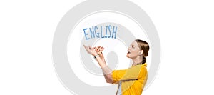 View of excited pretty girl with braid holding speech bubble with English lettering isolated on white, panoramic shot
