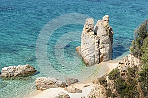 View of exotic beach, cliff, turquoise blue sea Greece, Halkidiki, Athos peninsula, Trimi beach Geological wonder nature