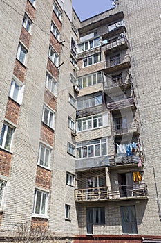 View on facade of cheap residential building. This is common type of low-cost apartment building in Russia and post-Soviet space,