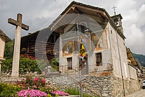 View of the facade of church in the historic center of Cheggio alpine village in Piedmont