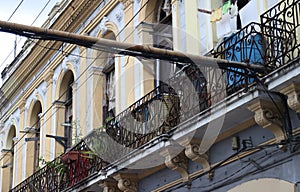 View of the facade with terrace of a building in Santiago de Cuba