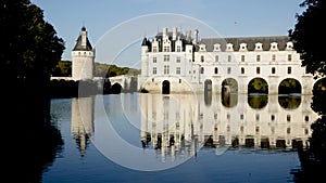 View of famous castle of Loire valley - Chateau de Chenonceau spanning Cher river, France