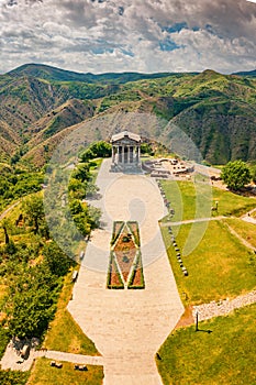 view of the famous Garni temple in Armenia. The historic Greek style building is located on the edge of a picturesque gorge