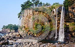 View of famous Jeongbang Waterfall on Jeju Island of Korea