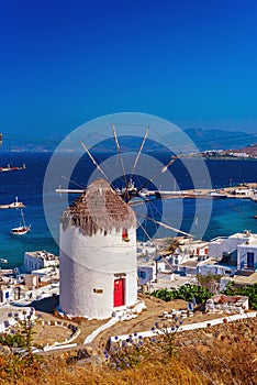 View of the famous Mykonos windmill above  port and Mykonos town