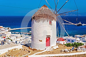 View of the famous Mykonos windmill above  port and Mykonos town