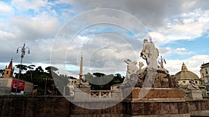 View of the famous Roman square Piazza del Popolo from behind the complex of statues of the Triton