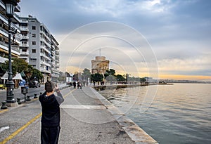 View of famous white tower and buildings of leoforos Nikis at  seafront. Thessaloniki, Greece