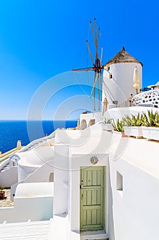 View of famous windmill in Oia village, Santorini island, Greece