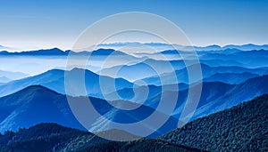 View of far away blue mountains in the fog photo