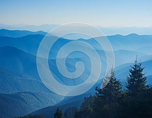 View of far away blue mountains in the fog photo