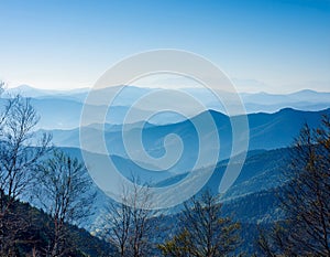 View of far away blue mountains in the fog photo