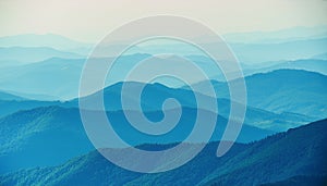 View of far away blue mountains in the fog photo