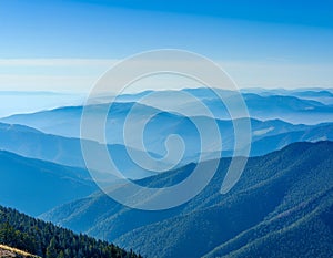 View of far away blue mountains in the fog photo