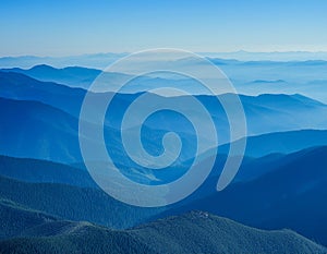 View of far away blue mountains in the fog photo