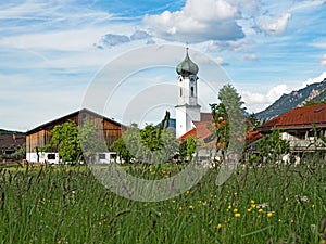 View of Farchant village with St. Andrew church in Bavarian Alps, Germany