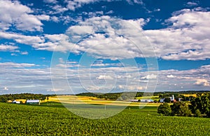 View of farm fields and rolling hills from a hill near Cross Roads, Pennsylvania.