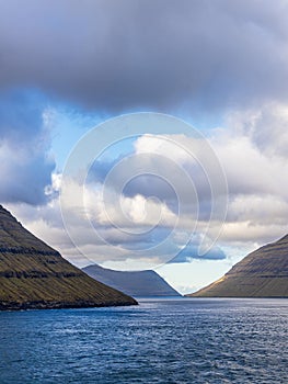 View of the Faroe Islands rocks with clouds