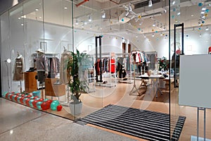 Female winter clothing store interior photo