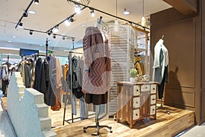 Female winter clothing store interior photo