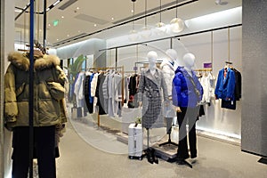 Female winter clothing shop indoor photo