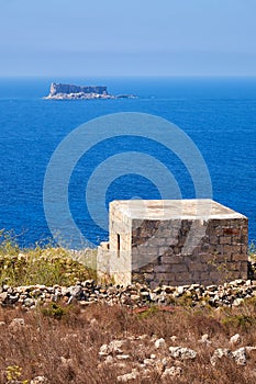 The view of Filfla islet with the guard building on the foreground.