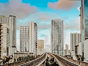View of financial district,skyscrapers and metrorail in Miami, Florida, United States.Modern Public transport.Fast way