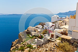 View of Fira town - Santorini island, Crete, Greece. White concrete staircases leading down to beautiful bay