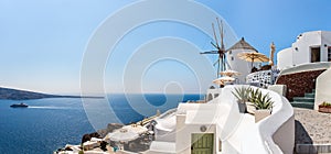 View of Fira town - Santorini island,Crete,Greece. White concrete staircases leading down to beautiful bay