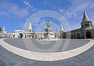 View of the Fisherman`s Bastion and  the equestrian statue of St. Stephen I of Hungary in the Buda Castle.