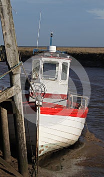 A view of fishing boat on Thornham Marsh, North Norfolk.