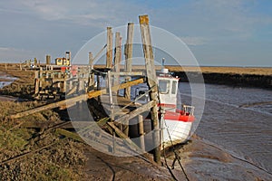 A view of fishing boat on Thornham Marsh, North Norfolk.