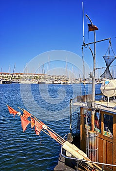 View from the fishing boat to the marina with sailing boats in the harbor Weisse Wiek