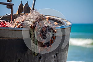 A view of a fishing net inside of the boat in the sea. Beautiful calm sea and water during an hot summer day