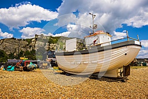 The view of fishing vessels moored on the beach at Hastings, Sussex, UK