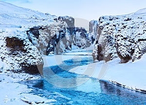 View of Fjadrargljufur canyon and Fjadra river in winter at twilight, Iceland