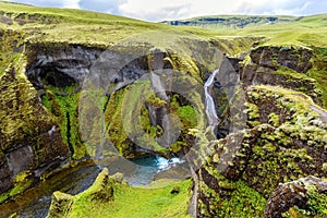 View of Fjadrargljufur Canyon towards the waterfall, and upstream of Fjadra river. South East of Iceland