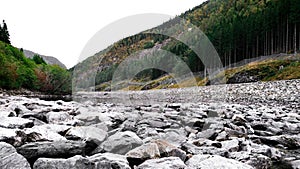 View of the fjord, mountain, great stones, nature, river and trees in Norway.