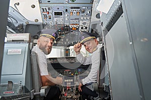 View of the flight deck and two friendly pilots in it