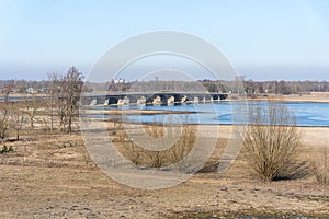 View of flooded field with bridge